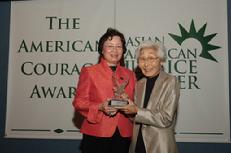 Dr. Leslie Moe Kaiser presents Susan Ahn Cuddy with the 2006 Asian American Justice Center American Courage Award at the National Press Club in Washington, D.C.