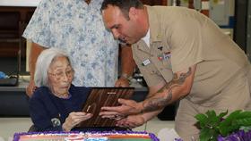 Susan Ahn Cuddy May 20, 2015 receivng appreciation for her Navy career from CPO Bradley Bryson at Point Mugu Naval Air Base Fleet Readiness Center